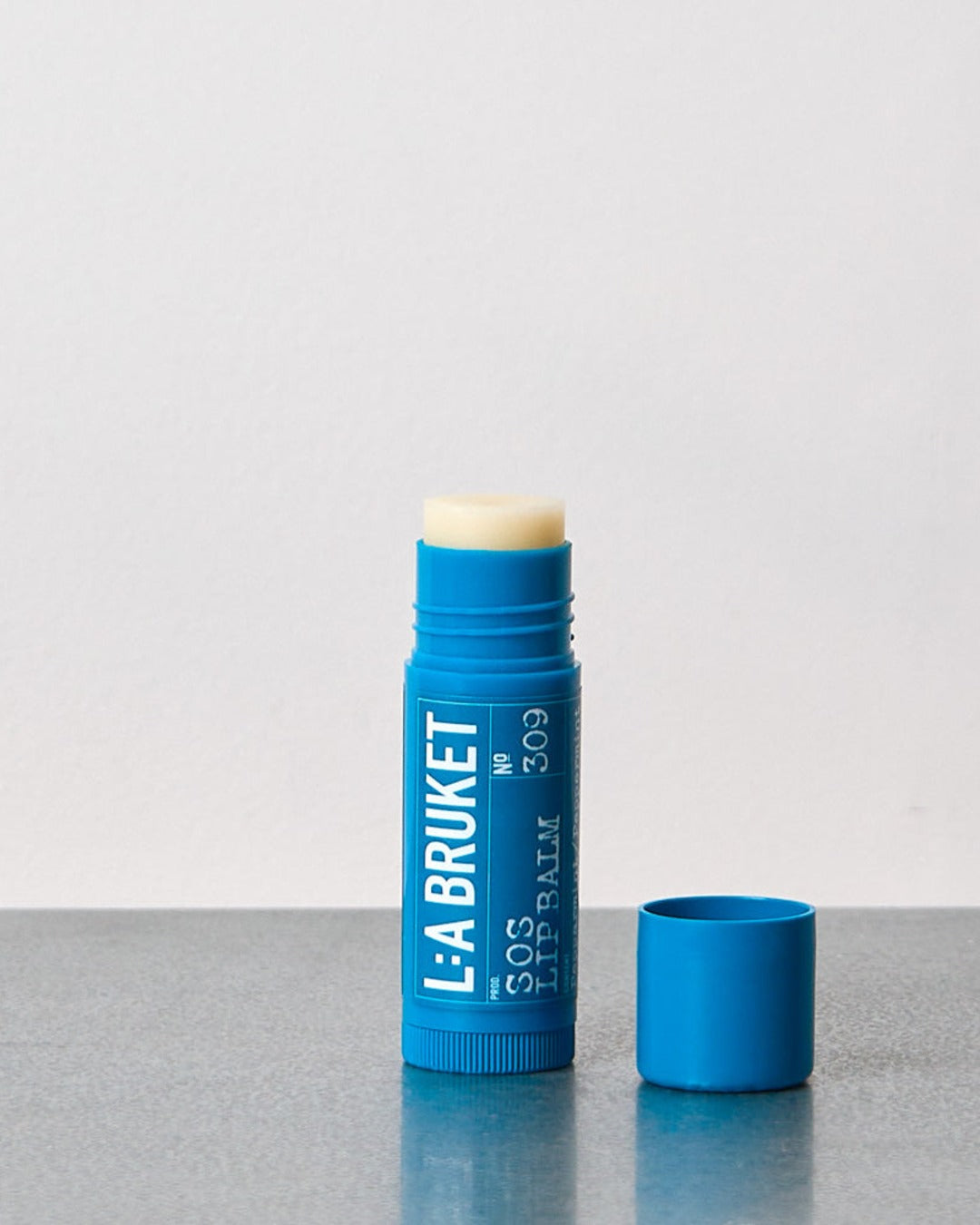 L:A Bruket - SOS Lip Balm