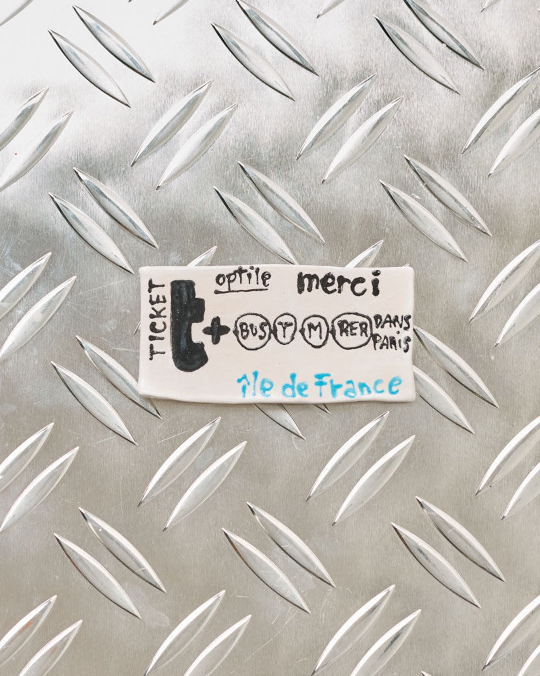 Merci x Michela Castagnaro - Metro ticket Merci ceramic