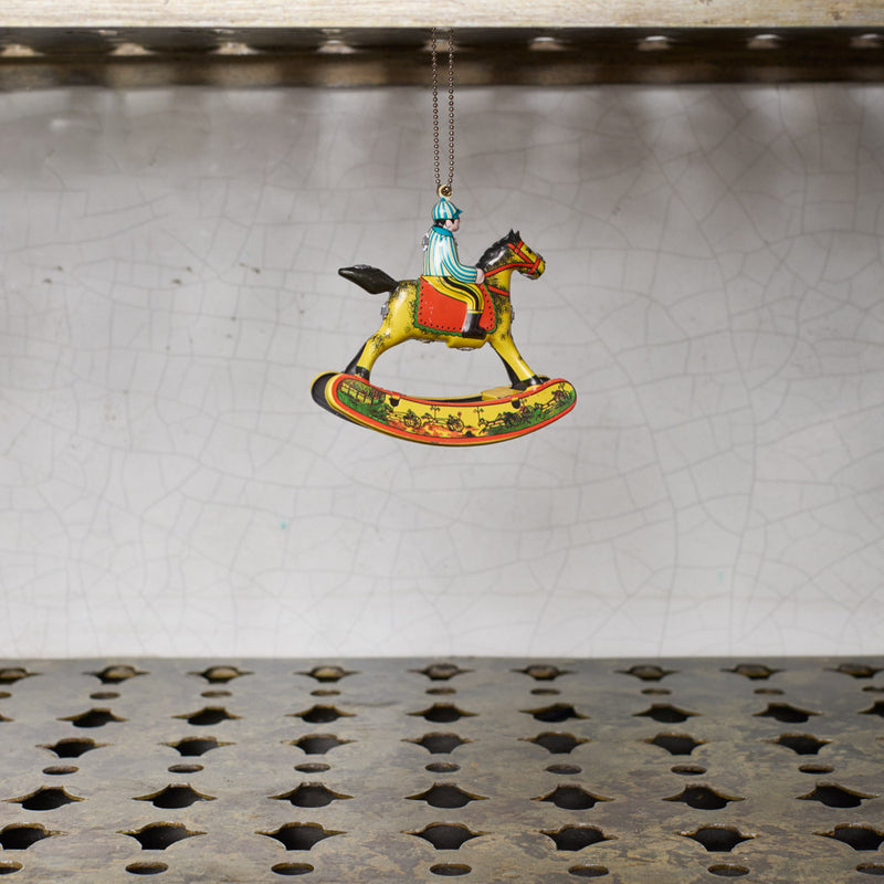 Ornement - Bonhomme sur cheval à bascule