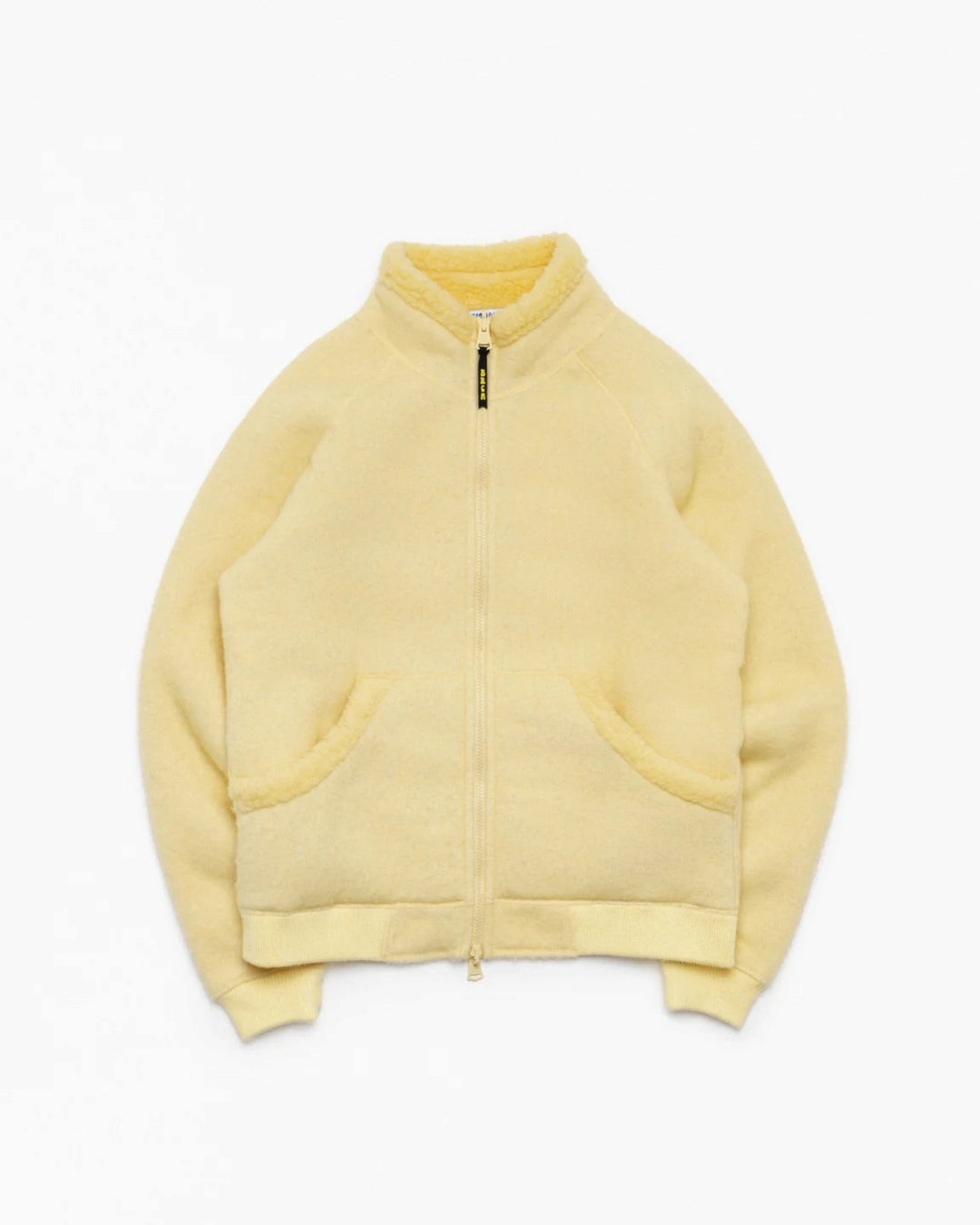 Veste réversible Merci Paris Big Rock Candy Tuolumne en laine mérinos jaune pâle avec fermeture zippée