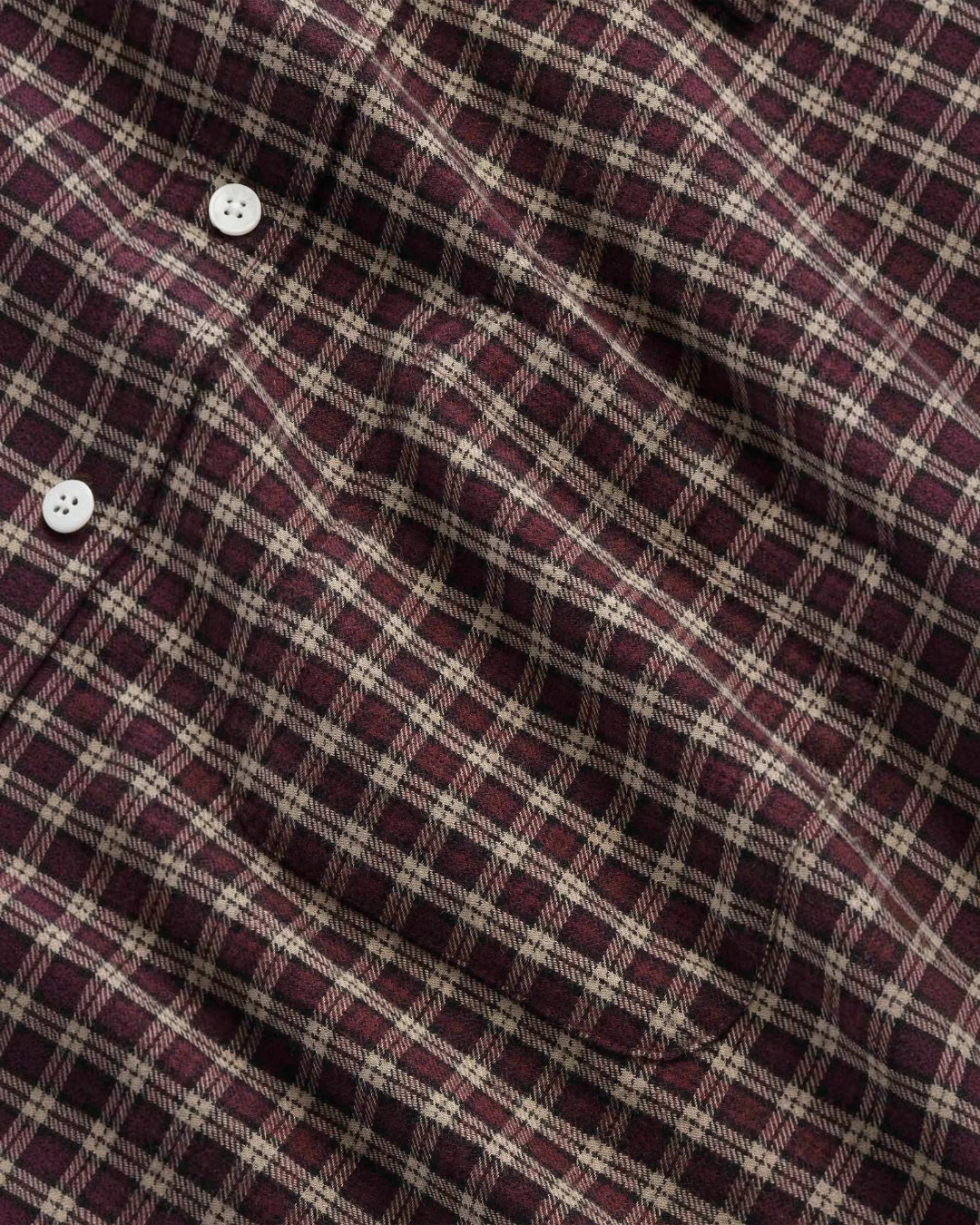 Chemise en flanelle de coton biologique à carreaux marron et beige de la marque Merci Paris avec poche poitrine