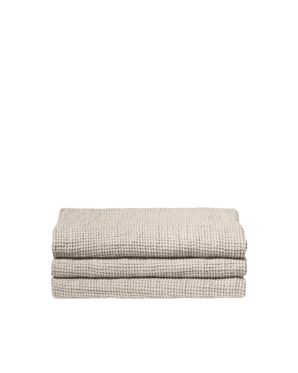 Serviette de bain Merci Paris en lin gaufré couleur pierre, texture moelleuse et absorbante pliée sur fond noir