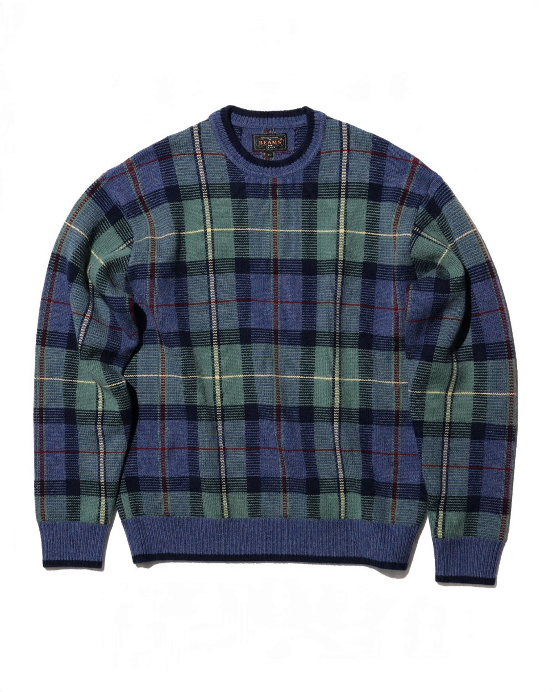 Pull Merci Paris Beams Plus en maille jacquard à motif tartan bleu, vert et ocre avec col rond en bord-côte marine