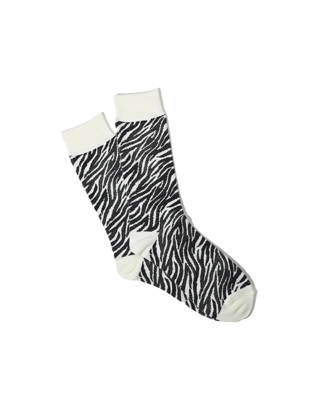 Chaussettes Merci Paris Anonymous ISM Animal Crew en coton écru et noir avec un motif zébré, fabriquées au Japon.