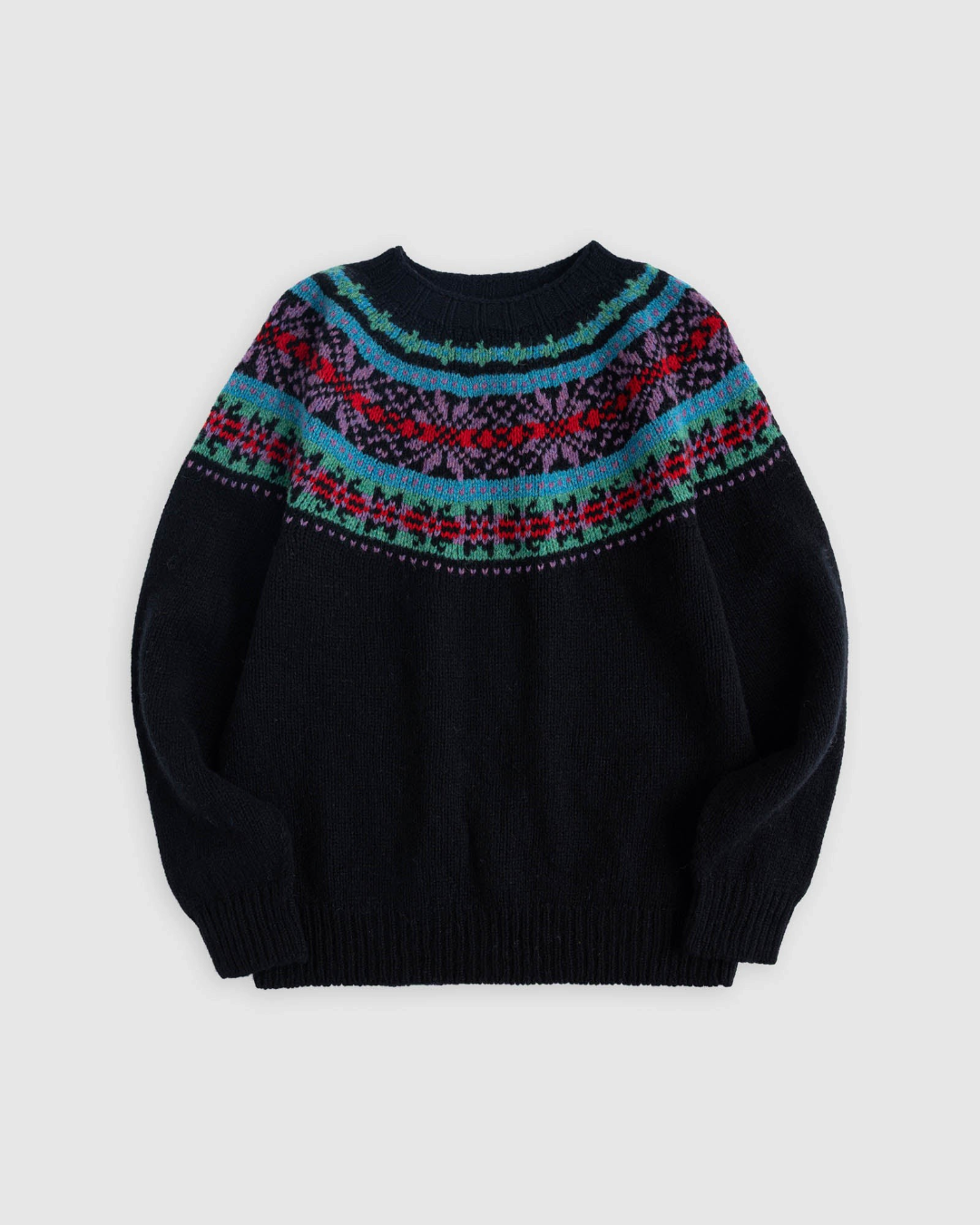 Pull Merci Paris Howlin' en laine Shetland noire avec empiècement jacquard coloré inspiré du style Fair Isle