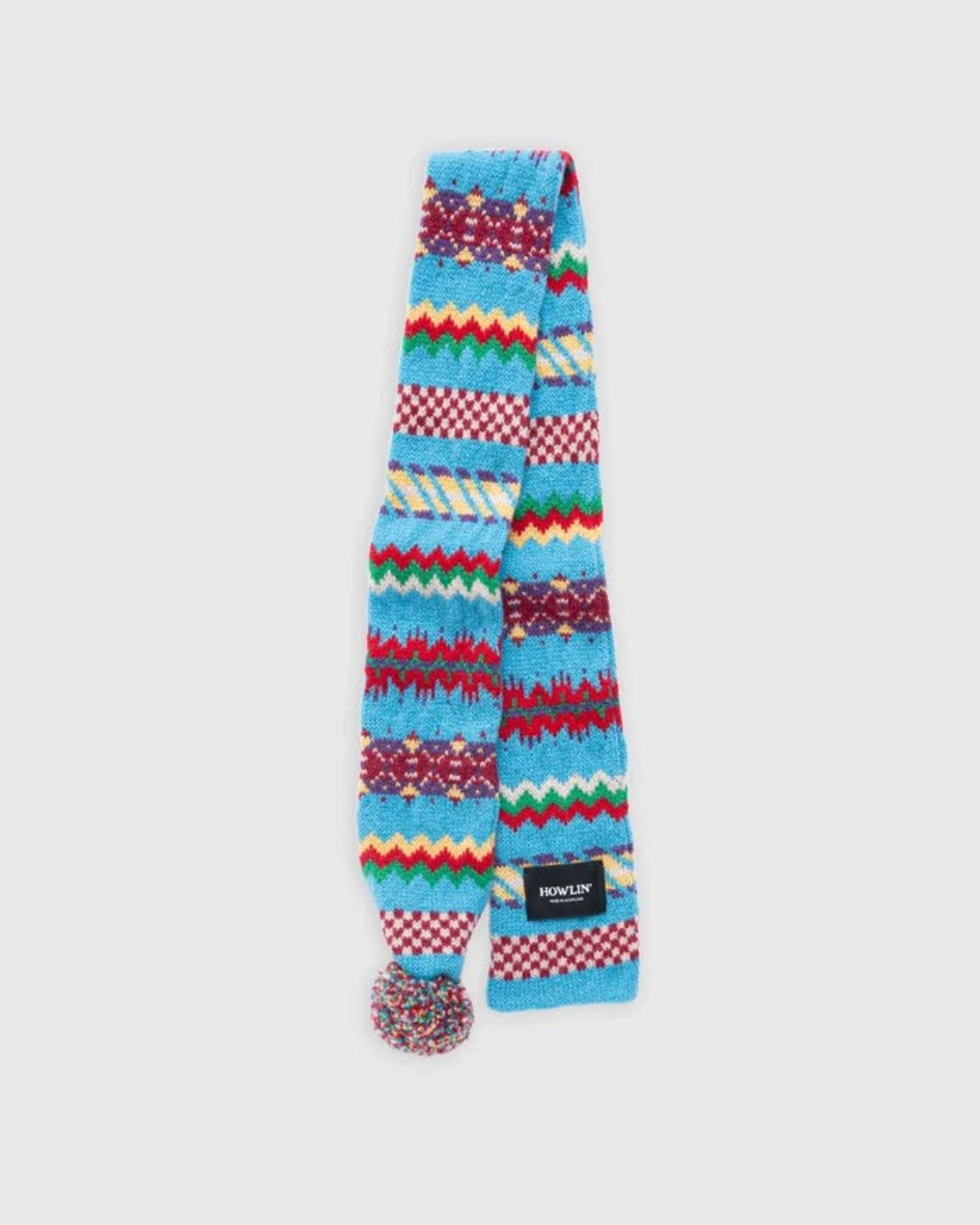 Écharpe Merci Paris Howlin' Small Woolen Wonder bleue en laine d'agneau avec motif Fair Isle et pompon coloré