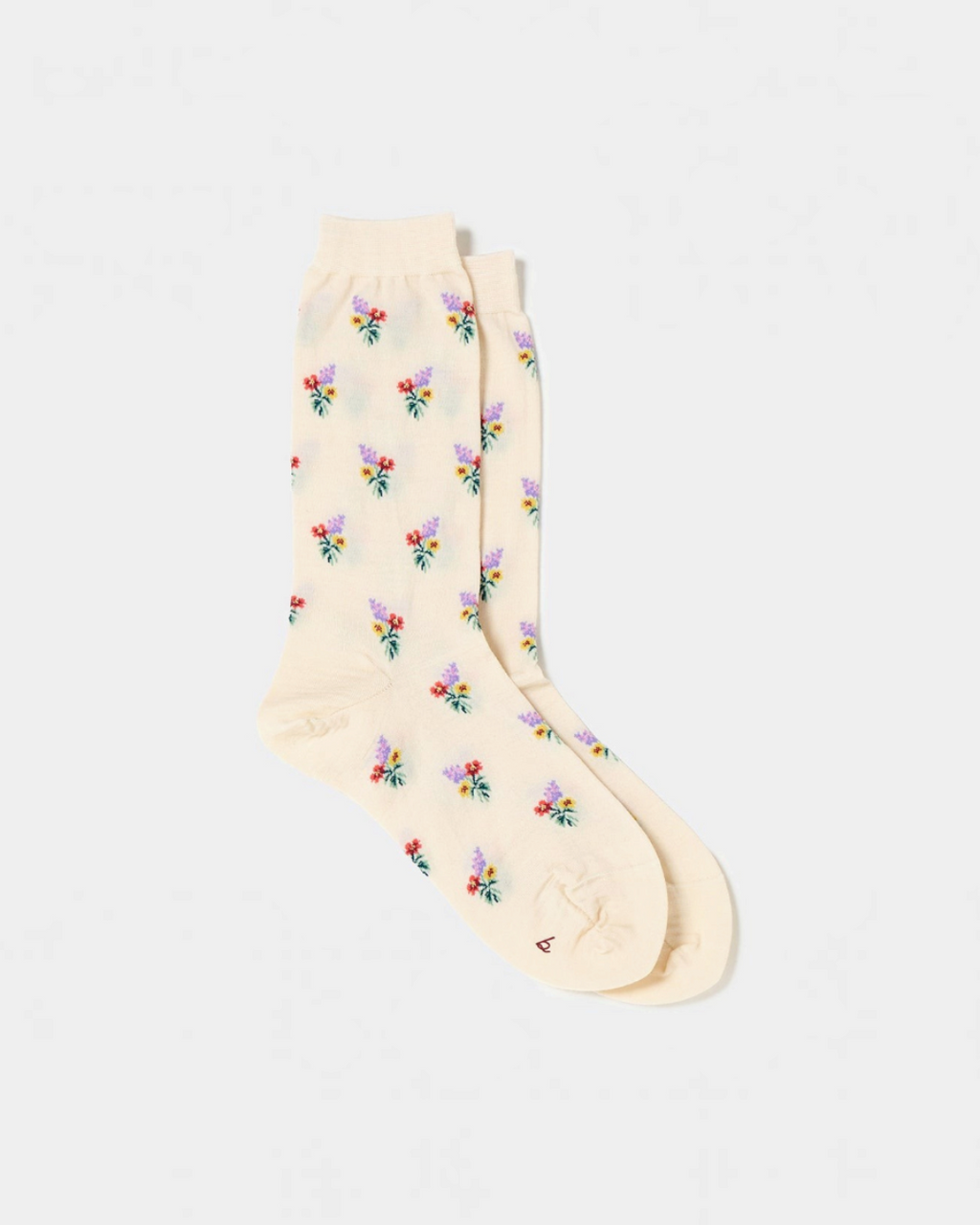 Chaussettes Merci Paris Babaco en maille écru avec motif de petits bouquets de fleurs colorés, fabriquées au Japon