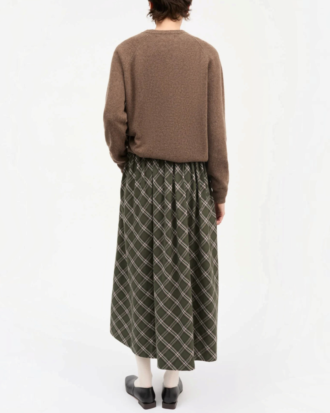 Rear view of a Merci Paris skirt Skall Studio Dagny in green and white checks in loose organic cotton