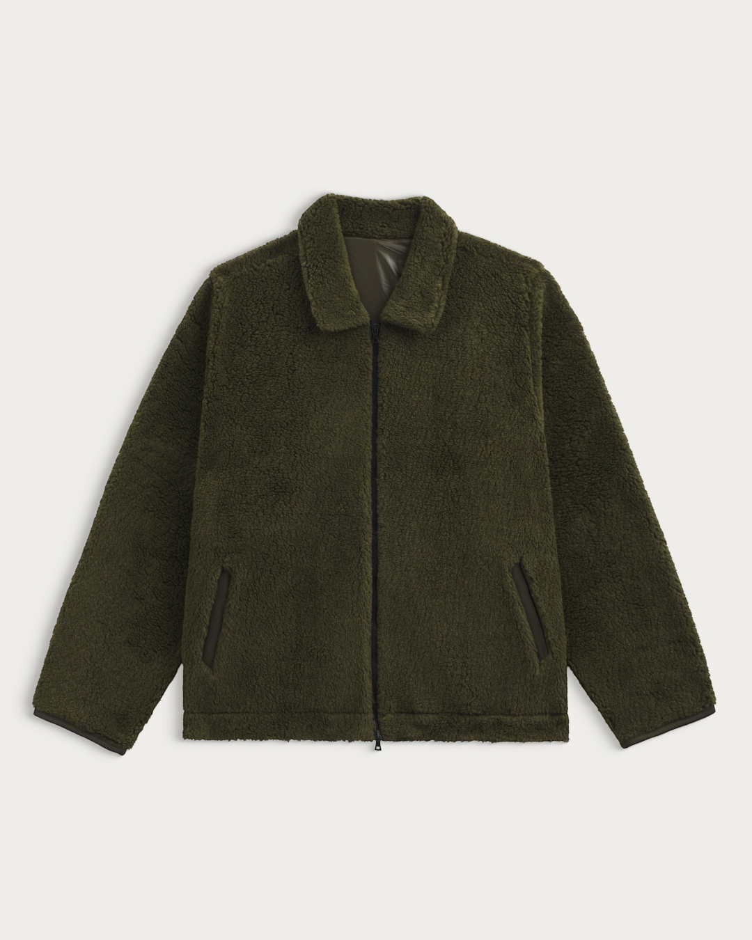 Veste polaire kaki Homecore Keafur avec col et finitions en moleskine, disponible chez Merci Paris