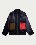 Veste Merci Paris Homecore Keanu Sleek bleu marine coupe boxy avec poches contrastantes marron et rouge