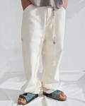 Pantalon Carpenter Merci Paris Dr Collectors blanc cassé en tissu japonais avec ceinture en corde et perles en bois