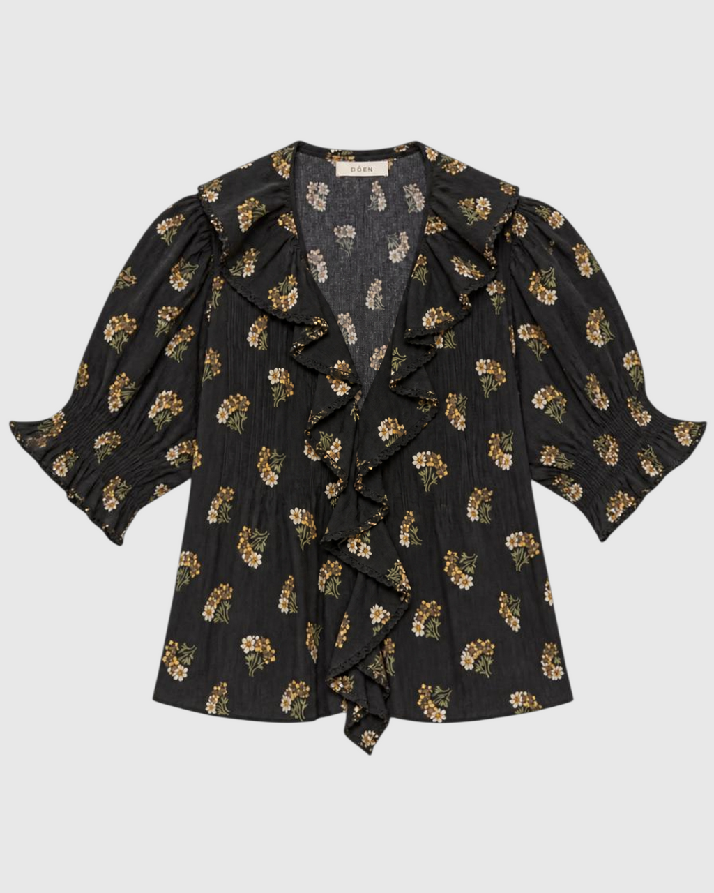 Blouse Merci Paris Doen Henri noire en coton biologique avec imprimé floral, volants en dentelle et manches bouffantes