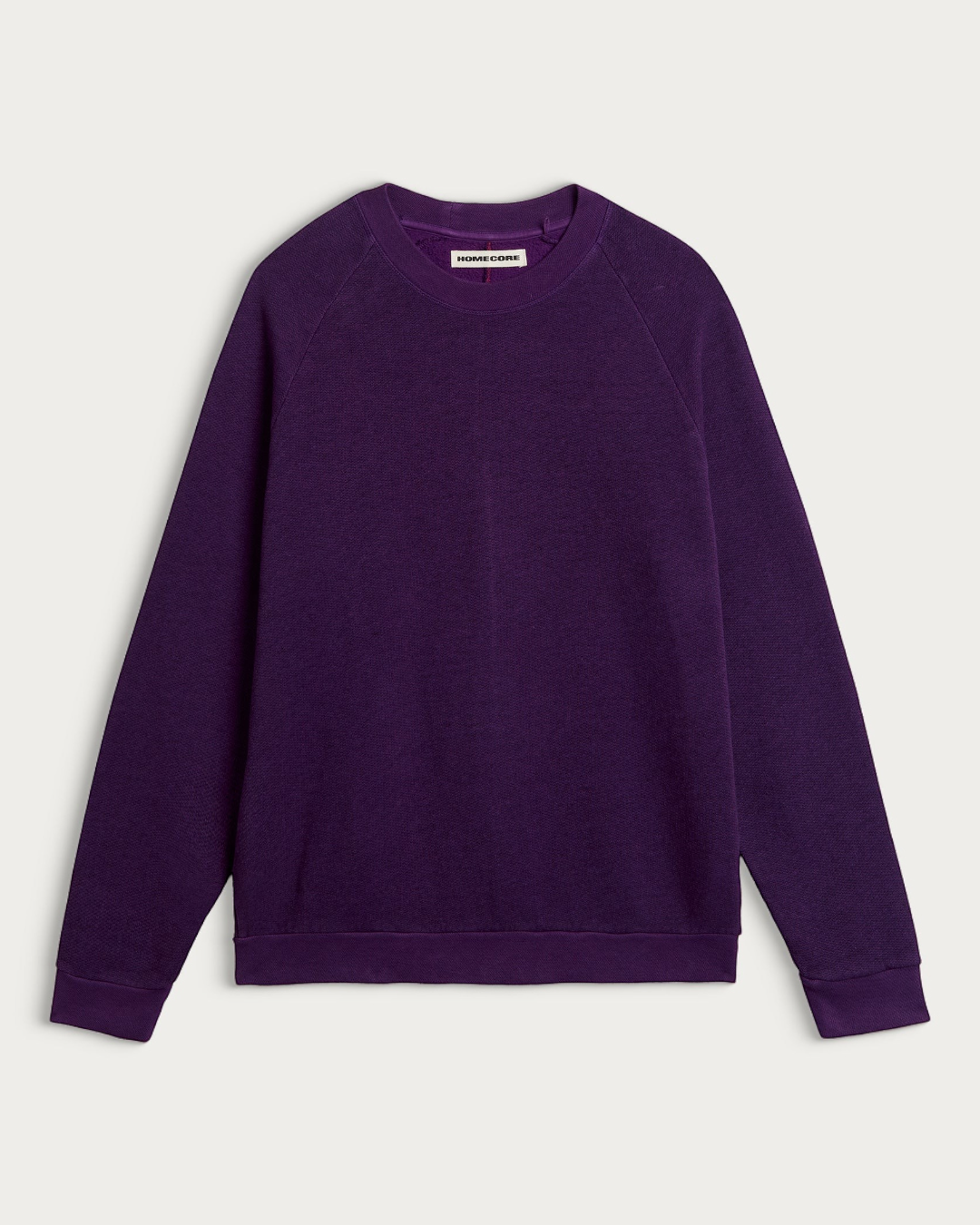 Sweat-shirt Homecore Terry couleur raisin avec manches raglan et bordures côtelées, vue de face sur fond neutre