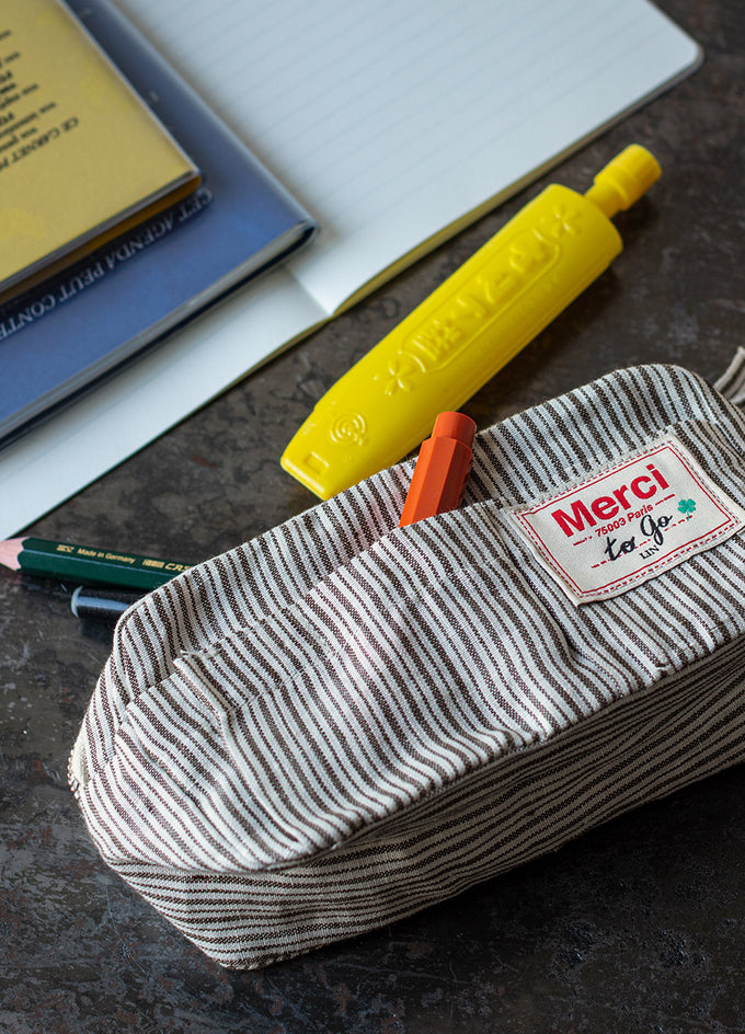 The pencil case <br> signed by Merci