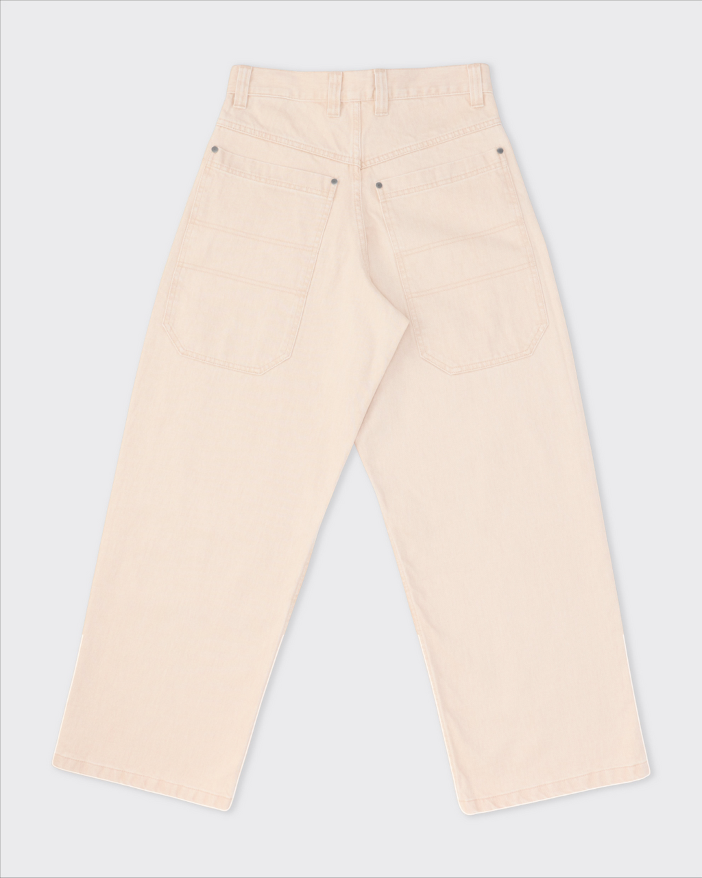 Vue arrière du jean Colbo en denim japonais beige pêche avec grandes poches, coupe droite et finition délavée.