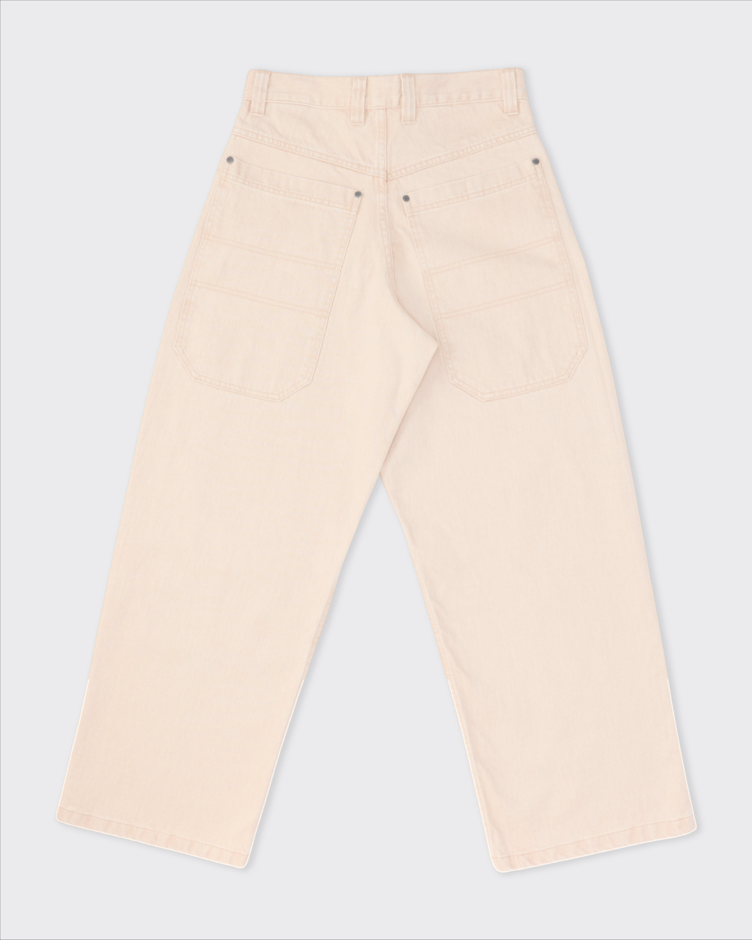 Vue arrière du jean Colbo en denim japonais beige pêche avec grandes poches, coupe droite et finition délavée.
