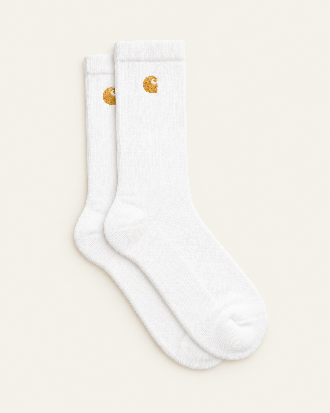Carhartt Wip - Chaussettes Chase - Blanc & Doré — paire en packshot sur fond écru